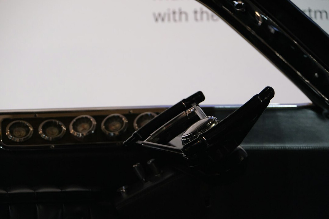 Close view of a vision mixer with multi-camera preview monitors behind it